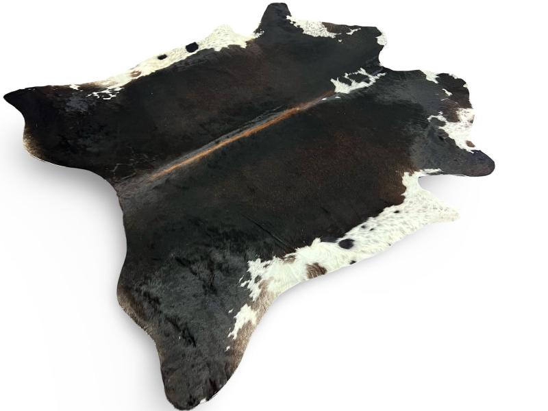 Black cowhide with white ends and brown spine