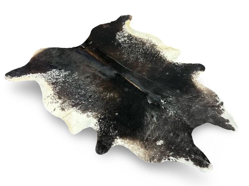 Black cowhide with white edges and white speckled spots on sides and neck