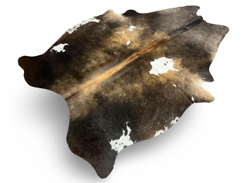 Dark dunn color cowhide with light brown centre and white patches