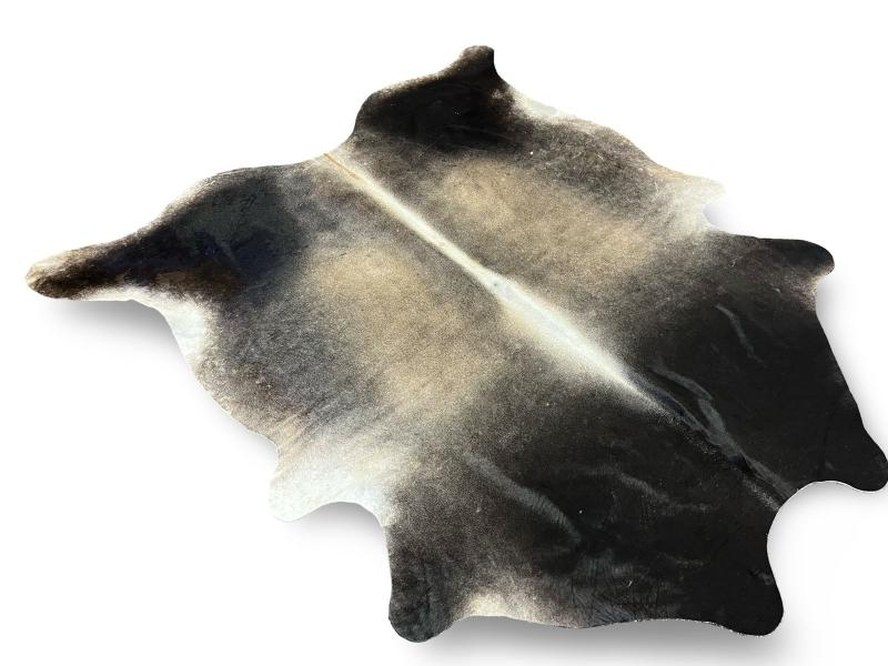 Light dunn color cowhide with dark dunn neck and white spine and under legs