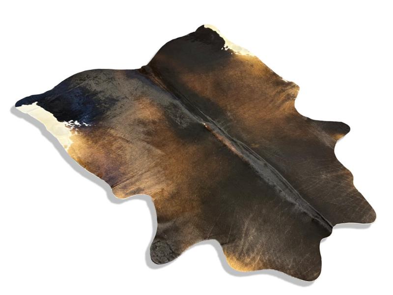 Tri color cowhide,black with brown middle and white back legs