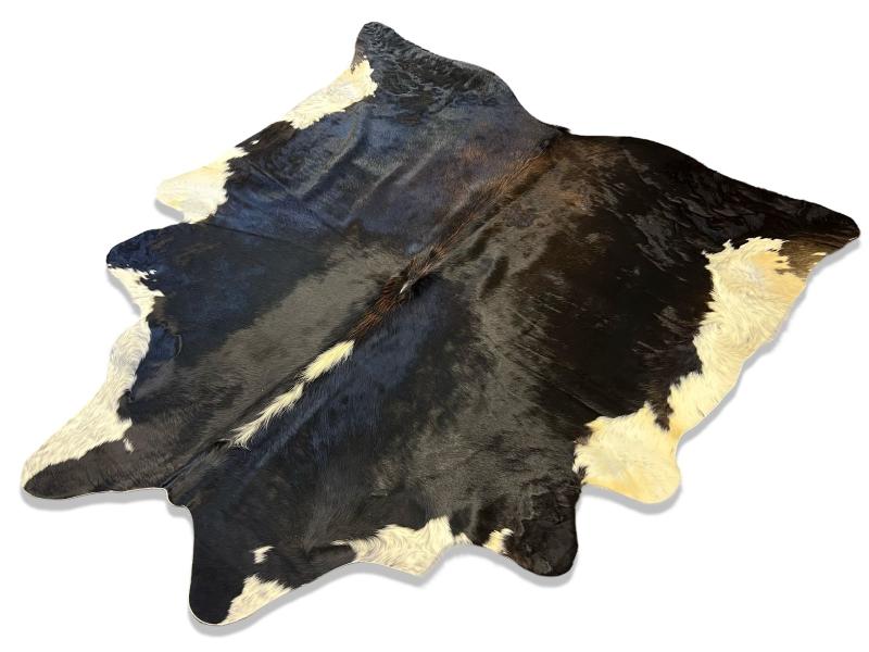 Tri color cowhide with a mix of black and brown and white ends