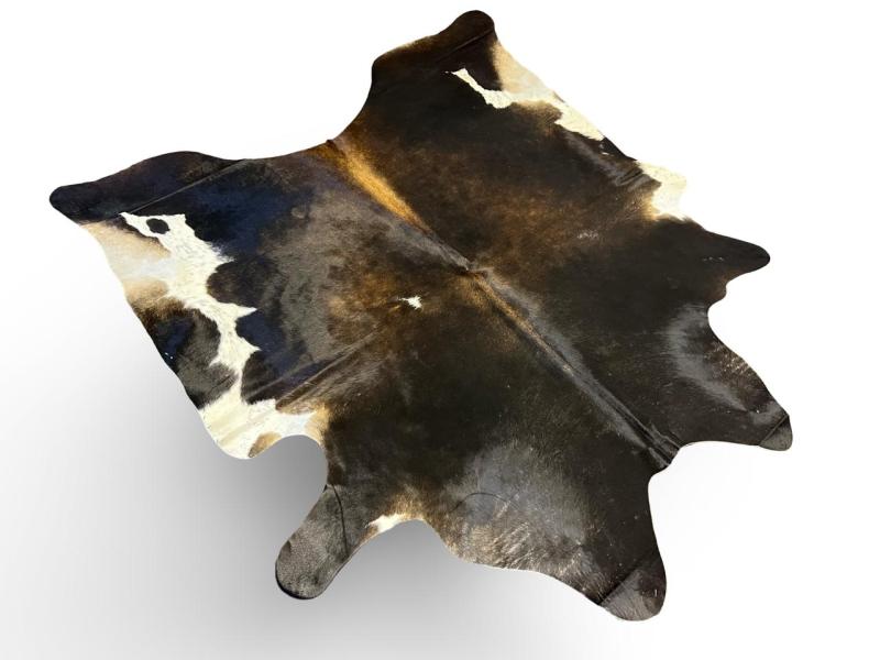 Tri color cowhide,mix of black with light brown in the middle and white on ends