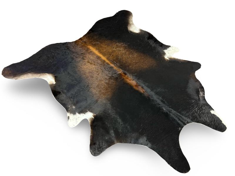 Tri color cowhide, black with light brown centre and white under legs