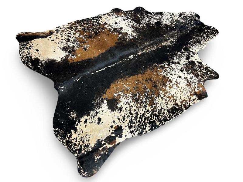 Printed cowhide,white with black spine and light brown patches on sides with black speckled sides