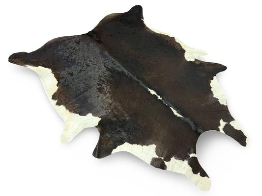 Black cowhide with white ends and white spine