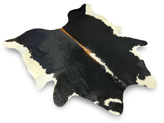 Black cowhide with white sides and a white and brown spine
