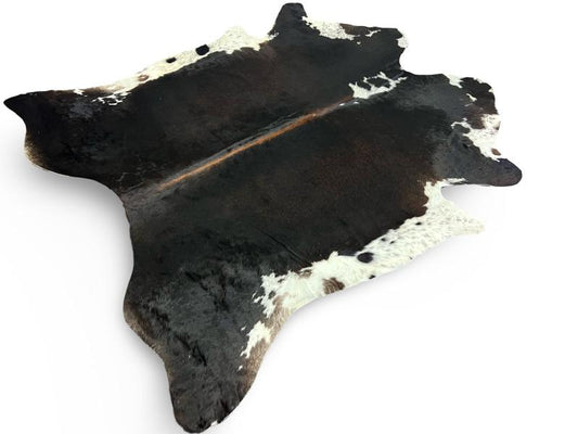 Black cowhide with white ends and brown spine