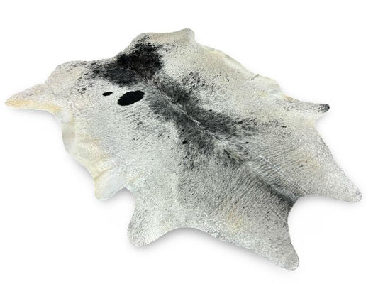 White cowhide with black speckled sides