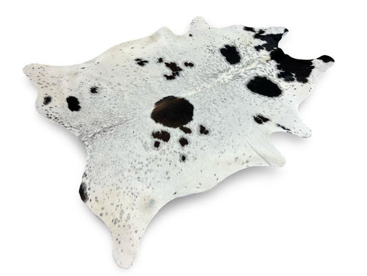 White cowhide with black speckled spots