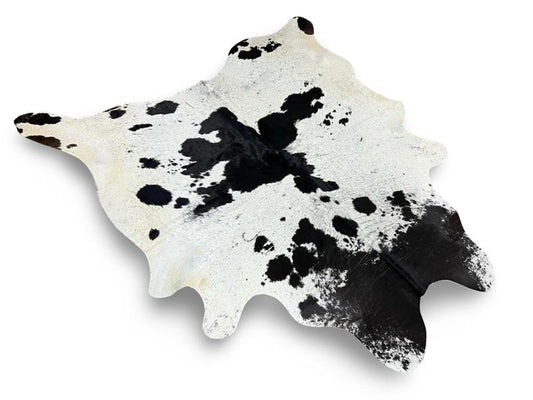 White cowhide with black neck and black speckled sides