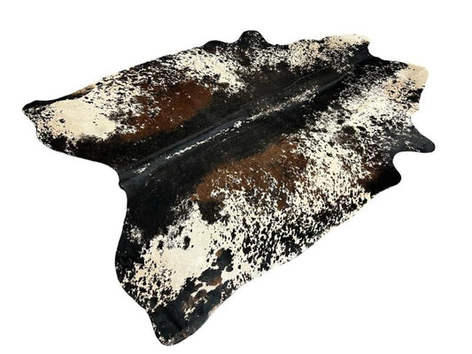 Printed cowhide, White with black centre and black speckled sides and dark brown patches on inner sides