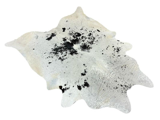 White cowhide with black speckled spots