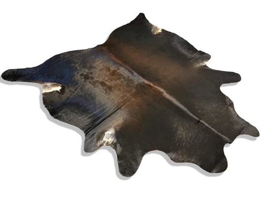 Dark brown cowhide with light brown centre and white spots on under legs