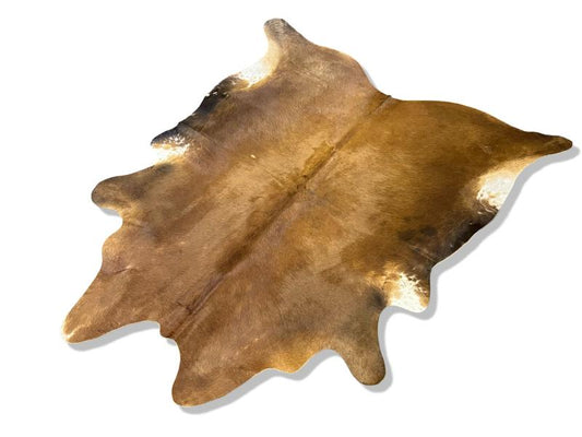 Light brown cowhide with white under legs