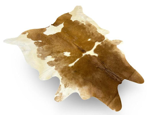 Light brown color cowhide with white patches