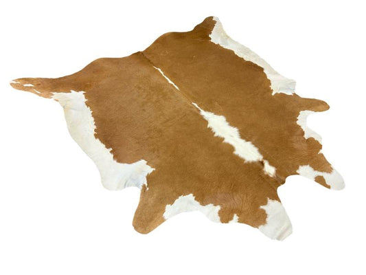 Light brown cowhide with white centre and white under legs