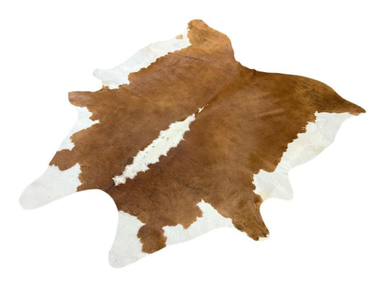 Light brown cowhide with white spine and ends