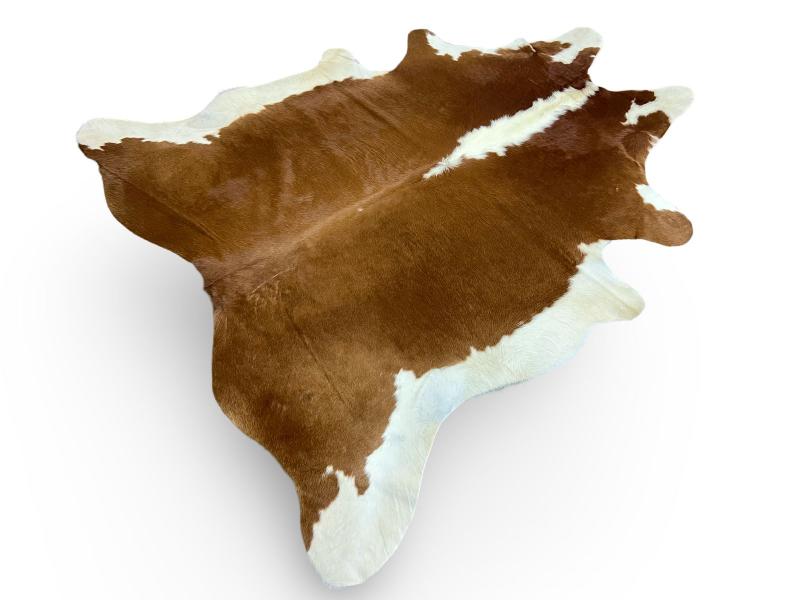Brown cowhide with white neck/spine and white ends