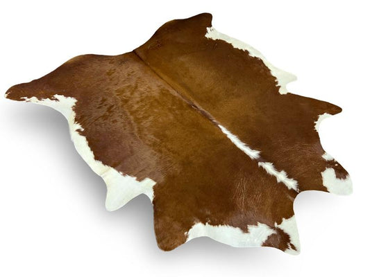 Dark brown cowhide with white spine and edges