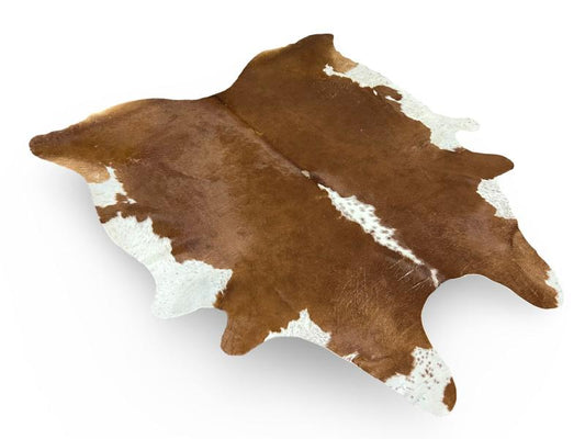 Dark brown cowhide with white on centre spine and white ends