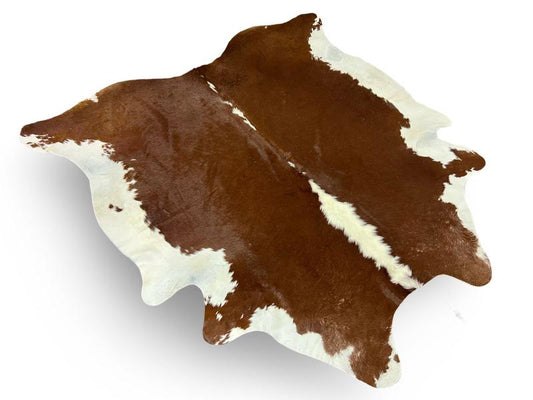 Dark brown cowhide with white spine and sides