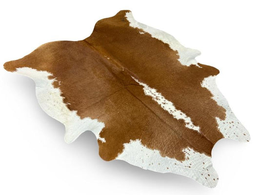 Dark brown cowhide with white sides and spine