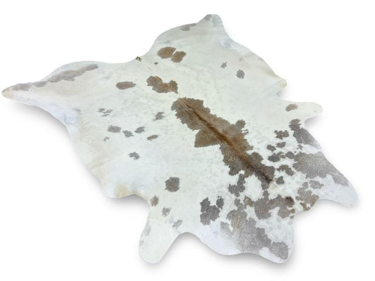 White cowhide with light brown speckled spots