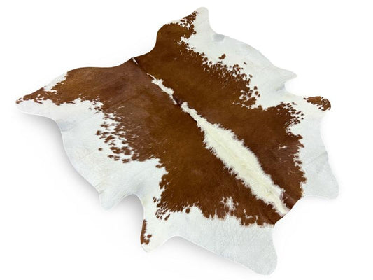 White cowhide with dark brown speckled sides