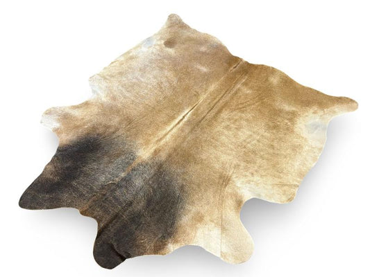 Light dunn color cowhide with black neck and white legs