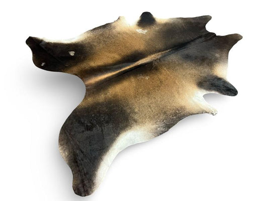Dark dunn color cowhide with light brown centre and white under legs