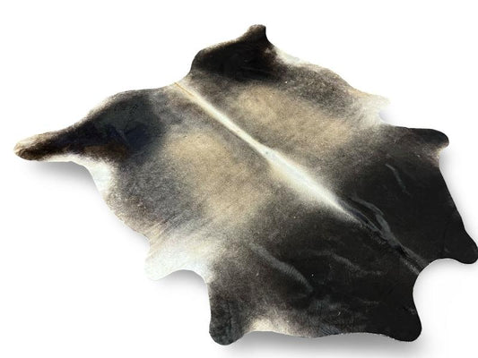 Light dunn color cowhide with dark dunn neck and white spine and under legs