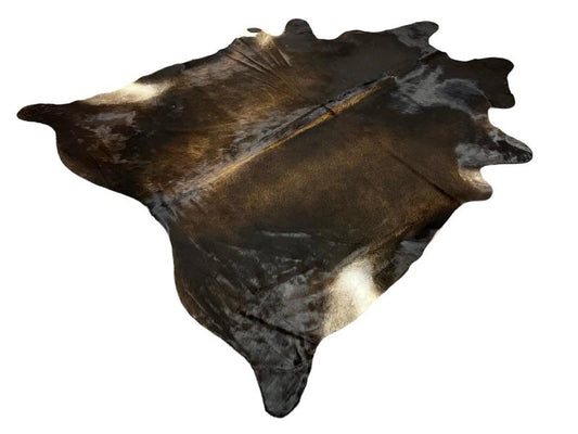 Dark dunn color cowhide with lighter brown centre and white under legs