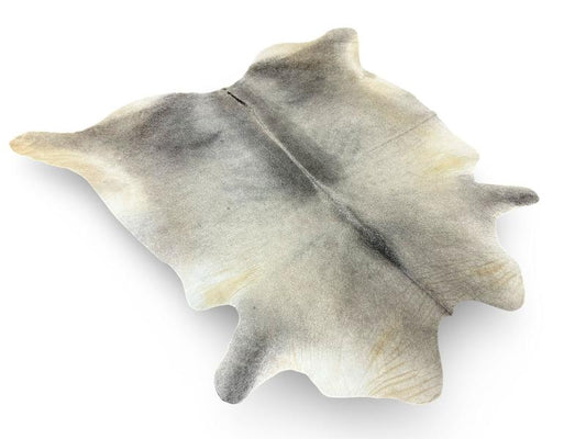 Light grey color cowhide with dark grey spine and legs
