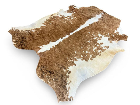 Nguni type cowhide,Light brown with white speckled sides and spine