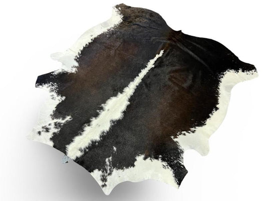 Nguni type cowhide.Black with a mix of dark brown with a white spine and ends