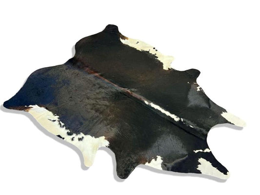 Tri color cowhide with black,brown and white edges and spine