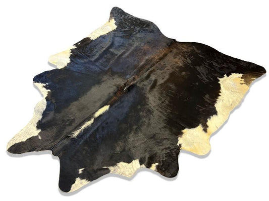 Tri color cowhide with a mix of black and brown and white ends