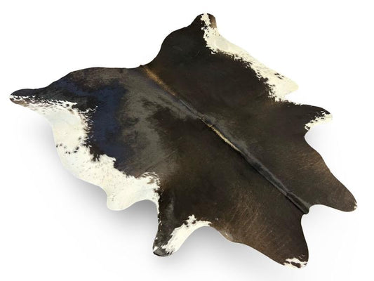 Tri color cowhide, black with a mix of dark brown and white on sides