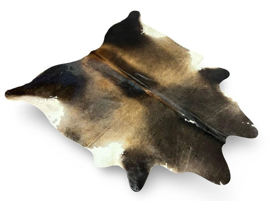 Tri color cowhide,black neck and back legs with light brown centre and white under legs