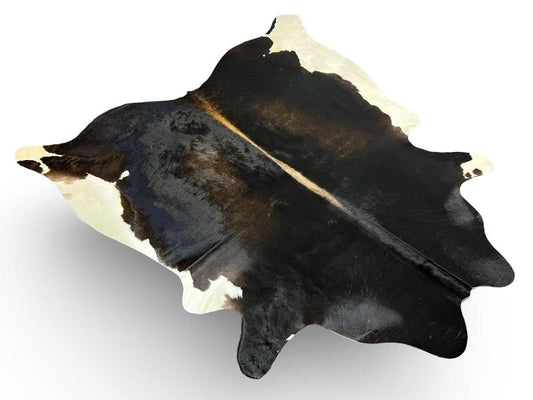 Tri color cowhide,mix of black and dark brown with white edges