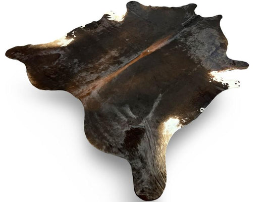 Tri color cowhide, black with dark brown spine and white ends