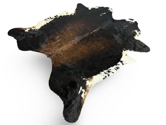 Tri color cowhide,black with a brown centre and white speckled ends