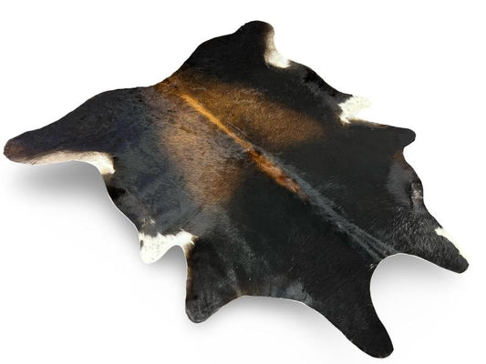 Tri color cowhide, black with light brown centre and white under legs