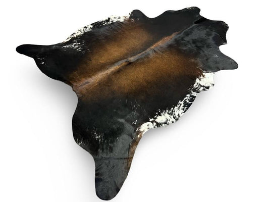 Tri color cowhide, black with chocolate brown centre and white speckled sides