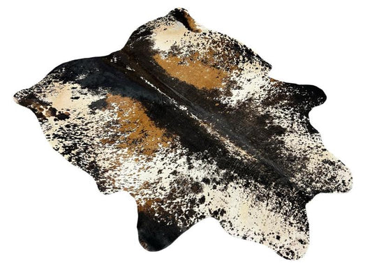 Printed tri color cowhide, white with black speckled sides and light brown patches on inner sides