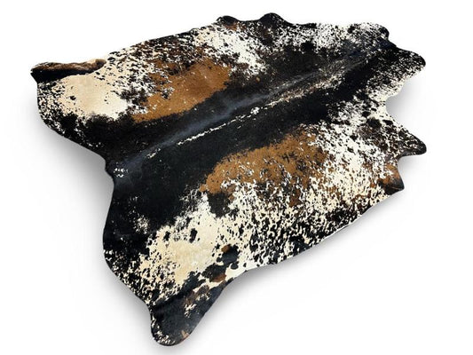 Printed cowhide,white with black spine and light brown patches on sides with black speckled sides