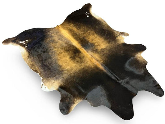 Tri color cowhide with black neck and back legs,Light brown centre and white spots on sides